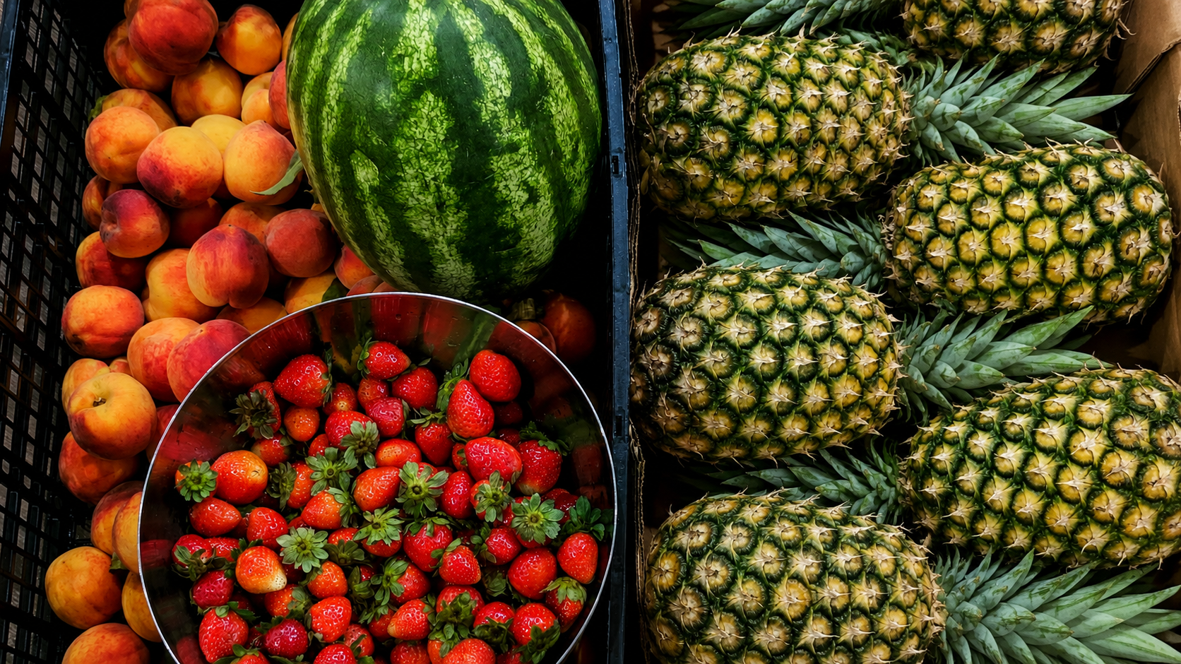 Fresh peaches, strawberries, watermelon, and pineapples used for Lemonicious fruit infusions